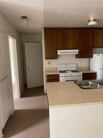 Los Angeles apartment for rent - an empty kitchen with a stove and a sink