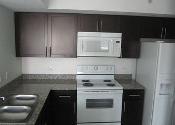 Princeton apartment for rent - a kitchen with a stove and a microwave