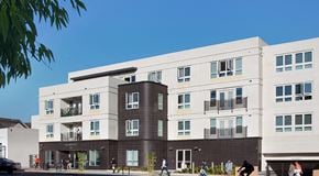Los Angeles apartment for rent - an image of a building with people walking in front of it