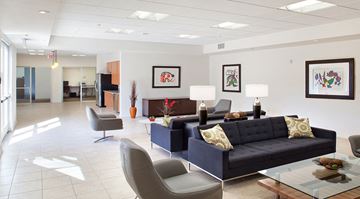 Los Angeles apartment for rent - a living room with couches and chairs and a table