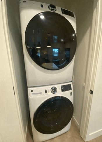 A front load washer and dryer in a laundry room