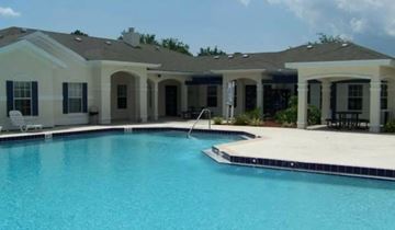 Palm Bay apartment for rent - A house with a pool in front.