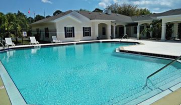 Palm Bay apartment for rent - A swimming pool in front of a house.