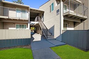 Suisun City apartment for rent - A concrete building with a staircase leading to the entrance at The Henley Apartments, Suisun City, 94585