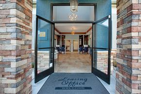 Suisun City apartment for rent - The entrance to a leasing office is shown with a mat on the floor at The Henley Apartments, Suisun City, California