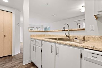 Vancouver apartment for rent - A kitchen with a sink and cabinets.