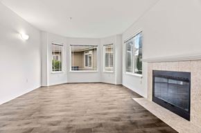 Vancouver apartment for rent - A living room with a fireplace and a large window.at Maple Ridge, Vancouver, WA