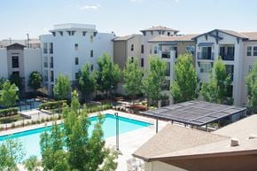 Dublin apartment for rent - an aerial view of a swimming pool with an apartment building in the background