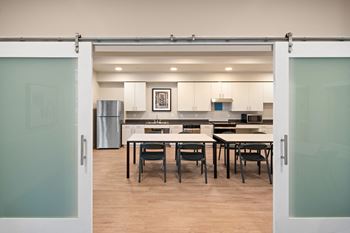 A modern kitchen with a dining area