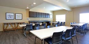 Colorado Springs apartment for rent - A large conference room with a long table and chairs.