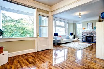 Tacoma apartment for rent - A living room with a white couch and a fireplace.