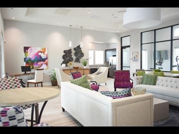 Fairfield apartment for rent - A living room with a white couch and a painting on the wall.