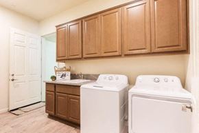 Modesto apartment for rent - a kitchen with a washer and dryer in it