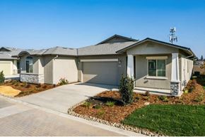 Modesto apartment for rent - a house with a gray roof and green grass
