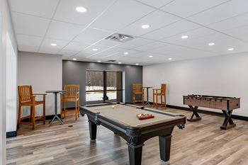 Game room featuring ping pong & foosball