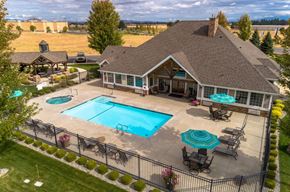 Spokane apartment for rent - A house with a pool in the backyard.