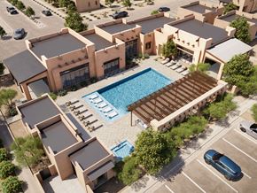 Santa Fe apartment for rent - A modern building with a pool in the middle of it.