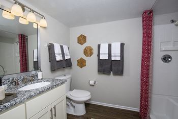 Sleek granite countertops in kitchen and bathrooms