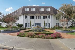 Fremont apartment for rent - Fremont, CA Apartments For Rent - Brookvale Chateau - Front Of Apartment Building Entrance With Lush Greenery And Florals