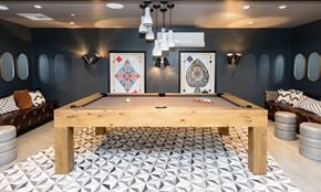 Oakland apartment for rent - A pool table in a room with a black and white tiled floor.