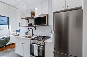 Minneapolis apartment for rent - a kitchen with stainless steel appliances and a stainless steel refrigerator