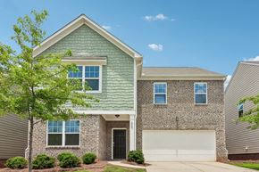 Locust Grove apartment for rent - A house with a green roof and a garage door.