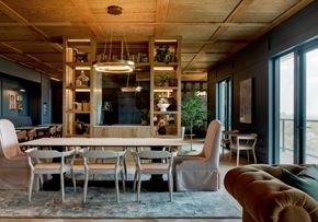 Dallas apartment for rent - A modern dining room with a large table and chairs.