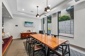 Minneapolis apartment for rent - A modern dining room with a wooden table and chairs.