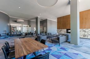 Stamford apartment for rent - A modern dining room with a wooden table and chairs.