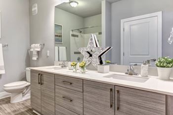 Renovated bathrooms with quartz counters