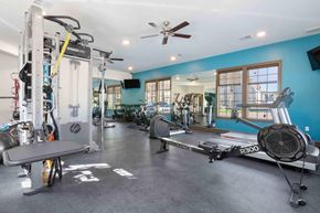 Parkville apartment for rent - a home gym with weights and a ceiling fan