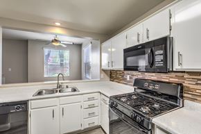 Henderson apartment for rent - Madison at Black Mountain apartments photo of a updated kitchen with black appliances