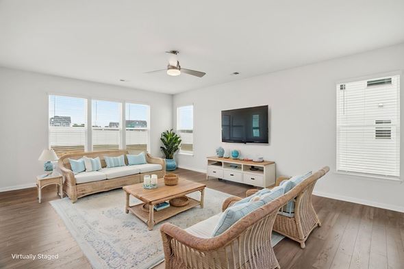 Fountain Inn townhouse for rent - A living room with a white ceiling and a television on the wall.