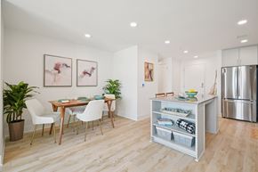 Raleigh apartment for rent - A kitchen with a table and chairs in the middle of the room.