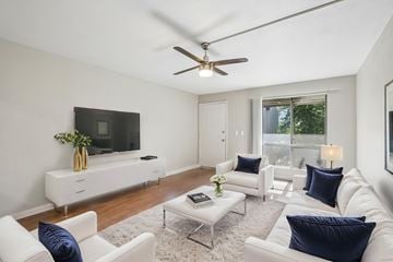 Tempe apartment for rent - A living room with white furniture and a flat screen TV.