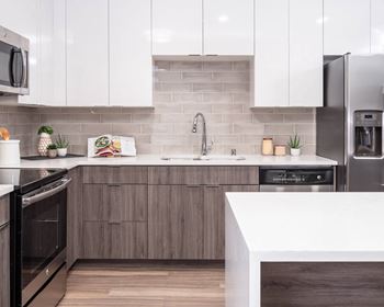 Waterfall-edge island, quartz kitchen countertops