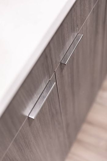 Designer, two-tone cabinetry with soft close