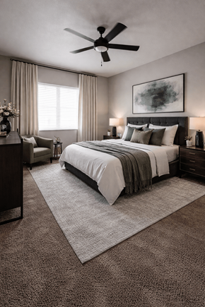 Las Vegas apartment for rent - A bedroom with a large bed and a ceiling fan.