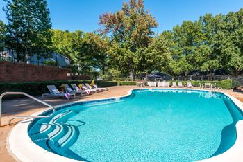 Refreshing swimming pool with lounge seating