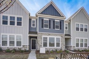 Charlotte townhouse for rent - A modern house with a grey and blue exterior.