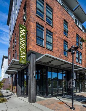 Seattle apartment for rent - 1 BR Apartments In Greenwood, WA - The Morrow - Exterior View Of Property With Brick Details and Many Windows
