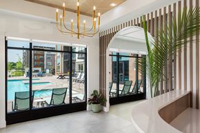 Coon Rapids apartment for rent - A modern interior with a pool and a view of the outside.