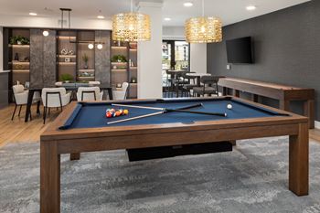 Game lounge with billiards, darts, and shuffleboard