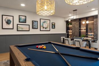 Game lounge with billiards, darts, and shuffleboard