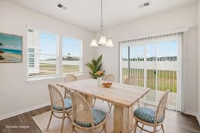 Fountain Inn townhouse for rent - A dining room with a wooden table and chairs.