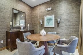 Houston apartment for rent - a dining room with a table and chairs and a mirror