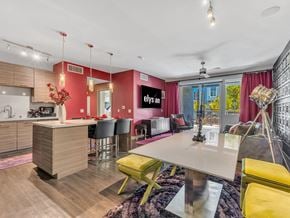 Henderson apartment for rent - A modern kitchen with a dining table and chairs.
