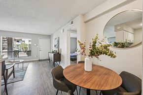 Glendale apartment for rent - A dining room with a round wooden table and chairs.