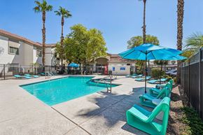 Phoenix apartment for rent - West Phoenix, AZ, Apartments for Rent - Del Mar Apartments - Resort Style Pool With Turquoise Lounge Seating, Blue Umbrellas, Palm Trees, And Fenced Sundeck Near Apartment Buildings.