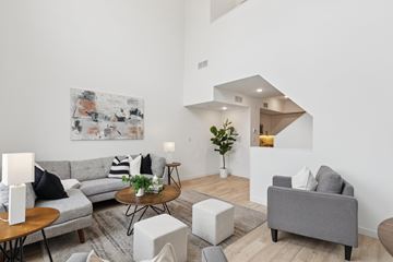 Philadelphia apartment for rent - A living room with a grey couch, a coffee table, and a painting on the wall.
